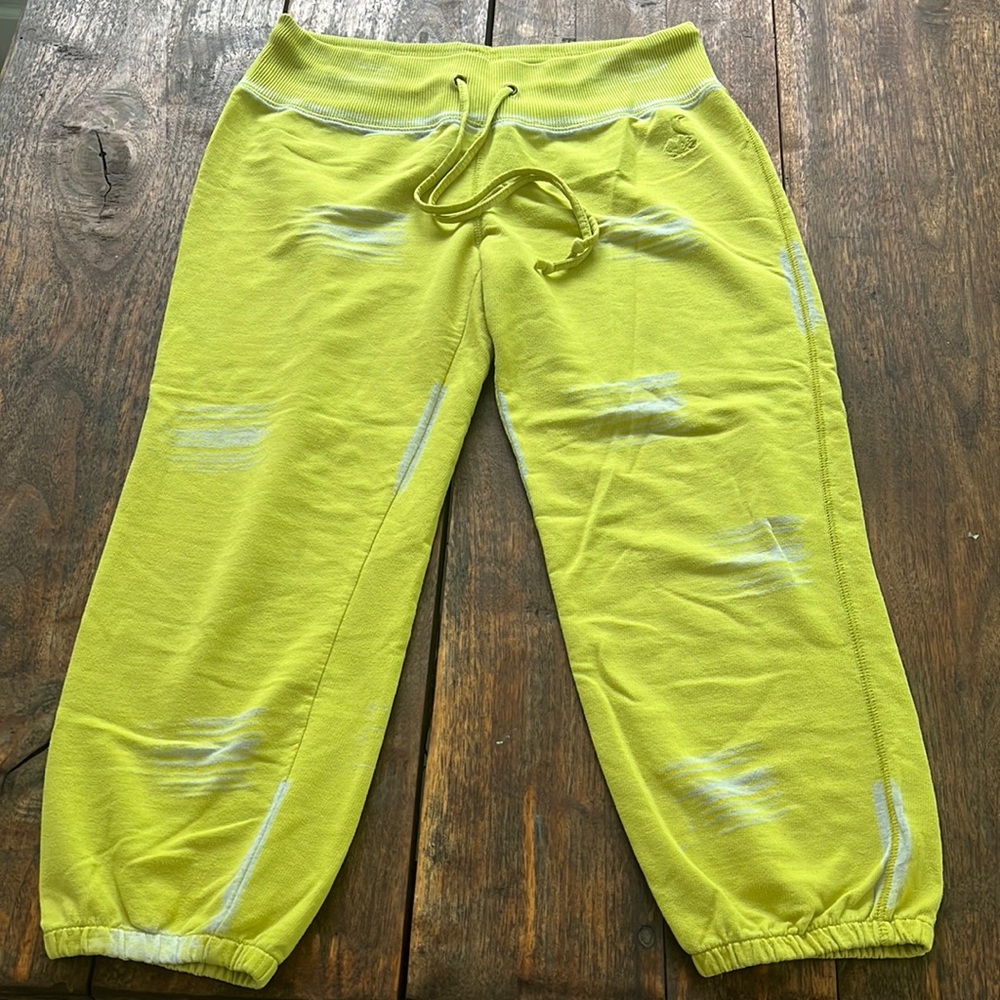 neon, lime, green sweatpants. Shin to ankle length depending on height.